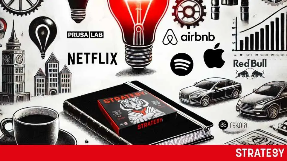 a black box with a red light bulb and a book